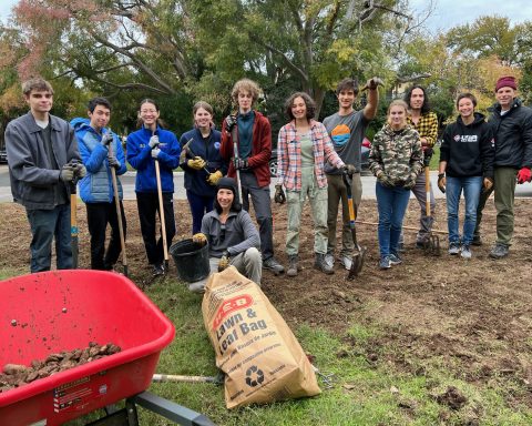 Juliette’s crew, taking a second to pose while planting. Left to right: Flynn Crawford, Patrick Chao, Crystal Ying, Sasha Krigel, Monica Flores (kneeling), James Hodges, Juliette Madere, Alfred Madere, Lucy Collier, Michael Detjen, Maya Madere and Steve Madere. Photo by Karen Kocher
