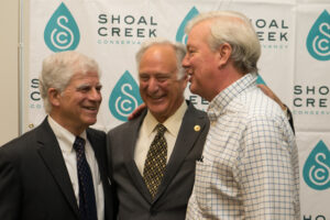 A scene from the annual Shoal Creek Awards ceremony in 2018, where Jim Marston, right, was honored with the Bob Armstrong Award for Lifetime Achievement in Conservation. Then Senator and former/future Mayor Kirk Watson, center, was on hand for the ceremony. Ted, left, was the Shoal Creek Conservancy board chair at that time.