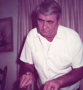 Linda’s father, Clyde, carves a Thanksgiving turkey. Dark meat, please.