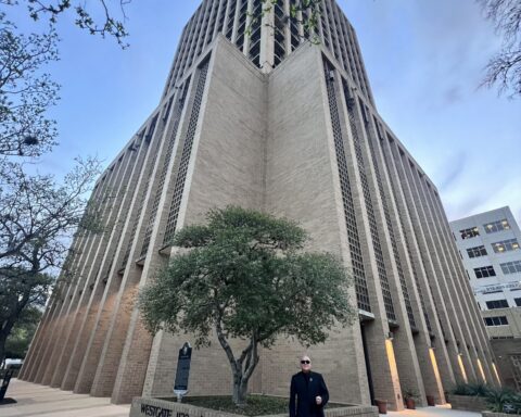Charles Peveto outside the Westgate Tower, where he lives.