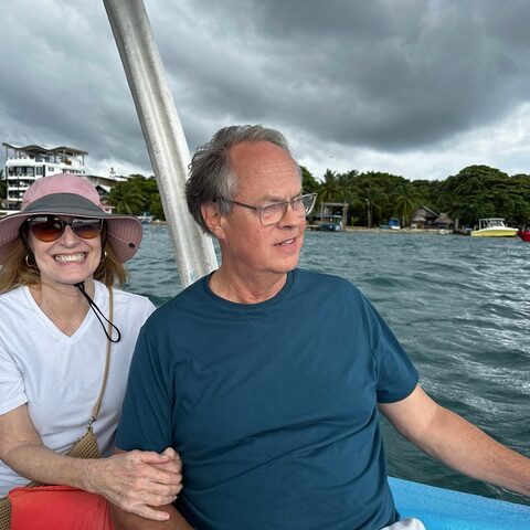 Kristy and Ben join family on a water taxi ride off Roatan, Honduras.