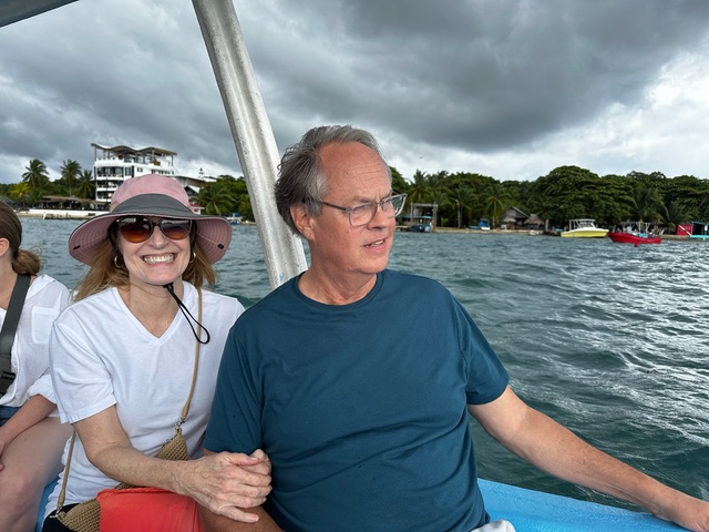 Kristy and Ben join family on a water taxi ride off Roatan, Honduras.