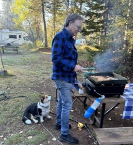 Loretta the Corgi and Mark Hallman monitoring breakfast, Sleeping Giant Provincial Park, Ontario