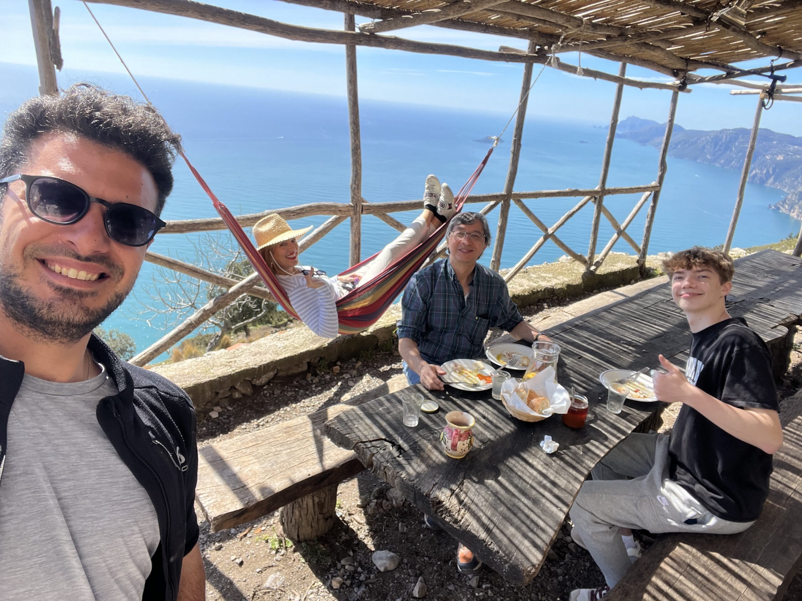 Their Italian hiking guide, Mela Sarajane Dailey, Peter Bay, and Colin Bay