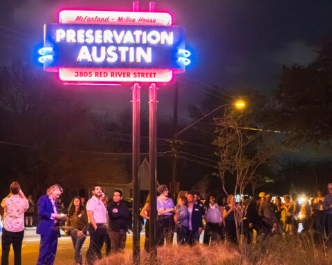 Lighting of the new McFarland-McBee House neon sign at the corner of Red River and 38 ½ Streets.