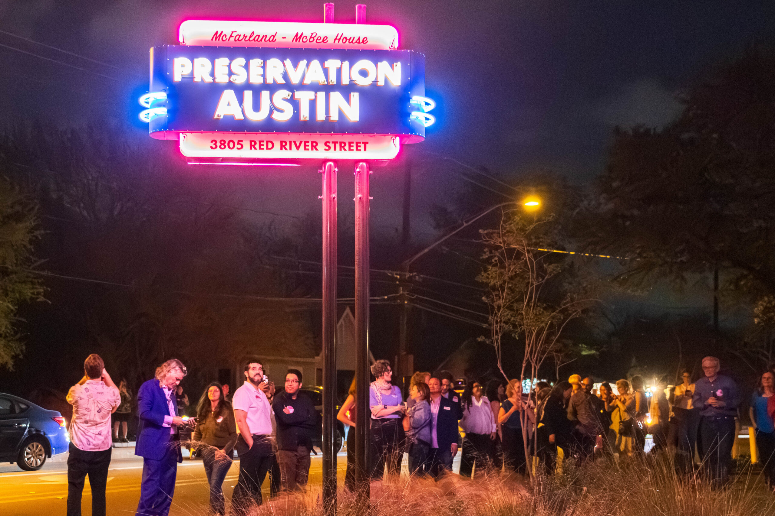 Lighting of the new McFarland-McBee House neon sign at the corner of Red River and 38 ½ Streets.