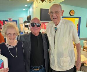 Charles Peveto (center) with Lynn and Frank Cooksey at Juan in a Million restaurant.