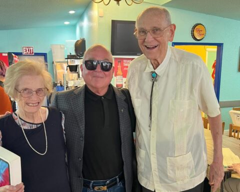 Charles Peveto (center) with Lynn and Frank Cooksey at Juan in a Million restaurant.
