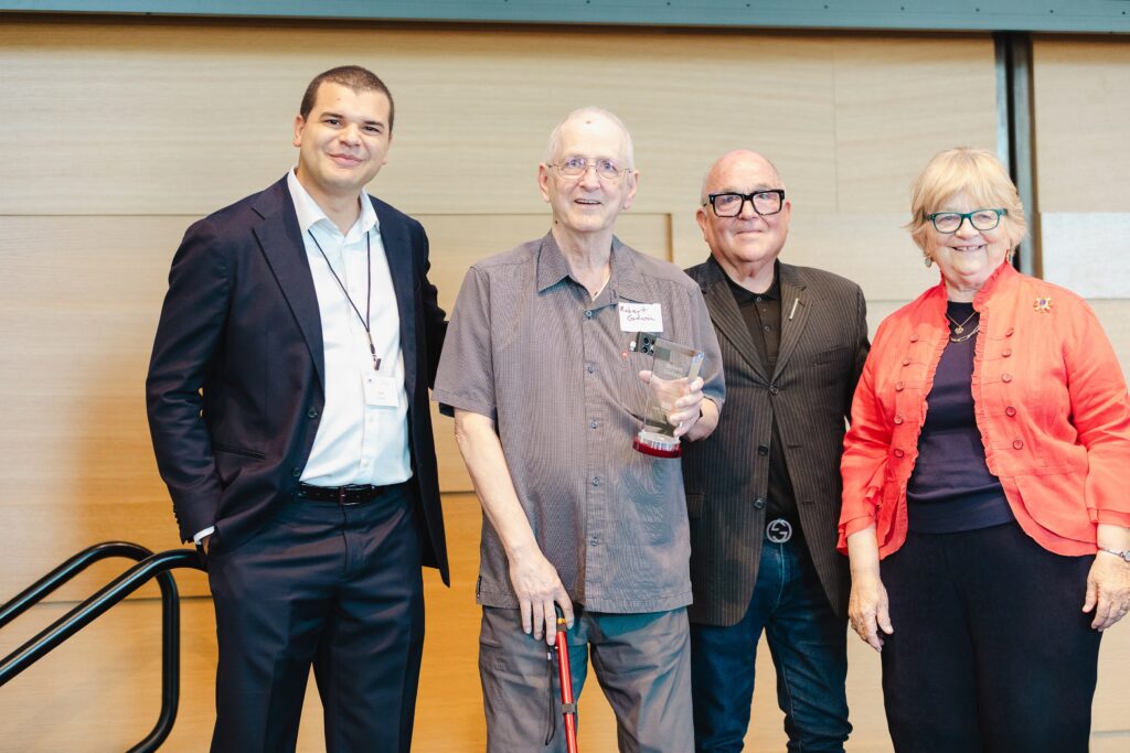 Robert Godwin received recognition for the decades he has spent chronicling Austin social history in news media and for the donation of his materials he is making to the Austin History Center. Left to right: Adam Powell, Robert Godwin, Charles Peveto, and Martha Hartzog.