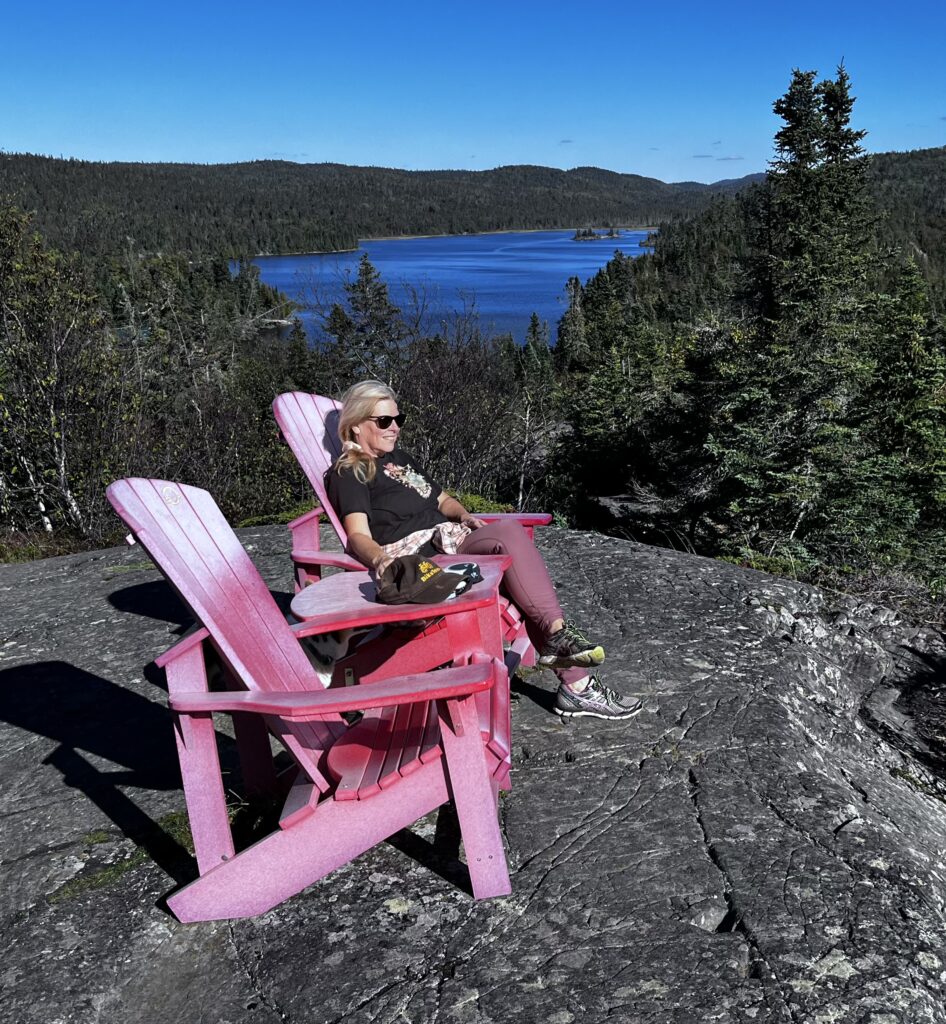 Kristen Hallman at the famous Parks Canada Red Chairs, Pukaskwa National Park, Ontario 