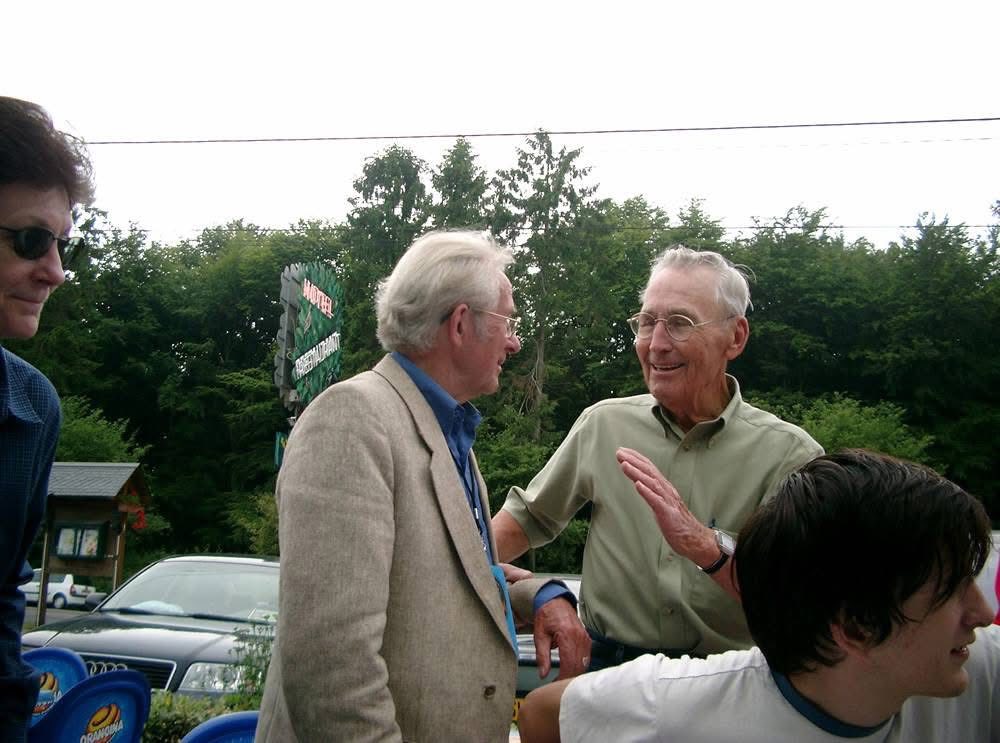 Paul Gray (green shirt) converses with Bruno, who was on the other side that fateful day. Bruno’s grandson is in the foreground, and Paul’s daughter Linda is on the left side of the photo.