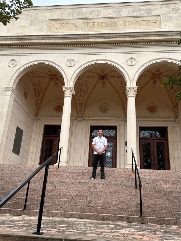 Adam Powell is working to make the Austin History Center’s Vision Plan come alive. Here you see him at the north entrance to the 1933 Library Building, which is part of the Center’s campus.