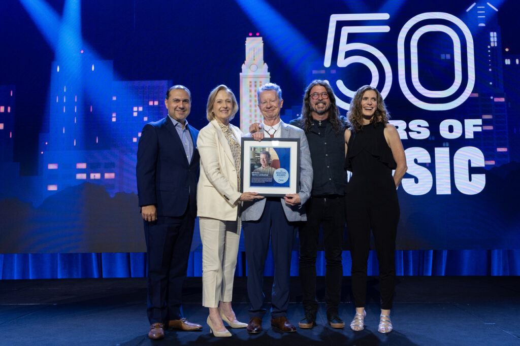 The presentation of Terry's Beacon Award saluting the 50-year run of Austin City Limits at PBS's Annual Meeting. Left to right: Luis Patiño, President, CEO Austin PBS; Paula Kerger, PBS President and CEO; Terry Lickona, Executive Producer, Austin City Limits; musician Dave Grohl; Catherine Robb, General Vice Chair, PBS Board. Photo credit: Scott Henrichsen. Photo courtesy Austin City Limits/Austin PBS.