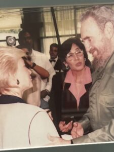 Rena, far left, with Fidel Castro during an interview.