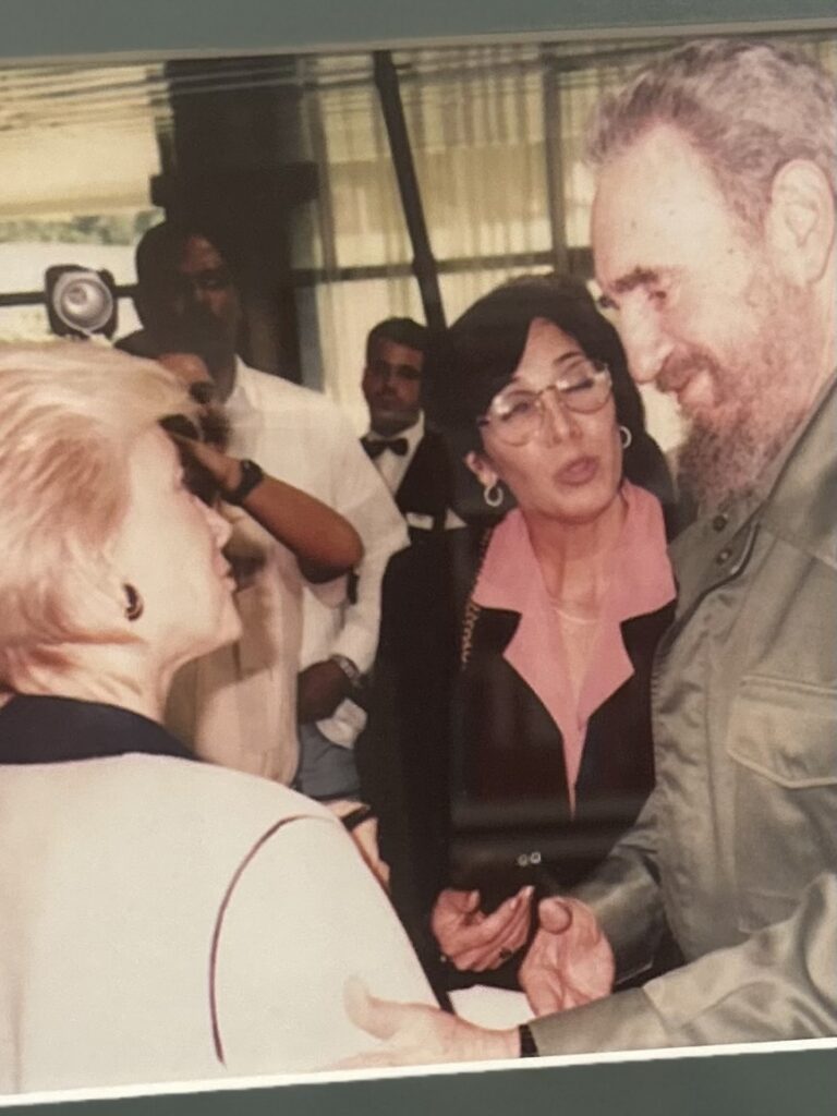 Rena, far left, with Fidel Castro during an interview.
