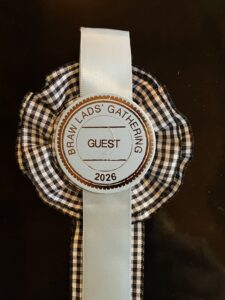 The black and white cockade and visitor badge presented to Martha at the 2026 “Braw Lads and Lassies” Gathering, photo by Martha Hartzog