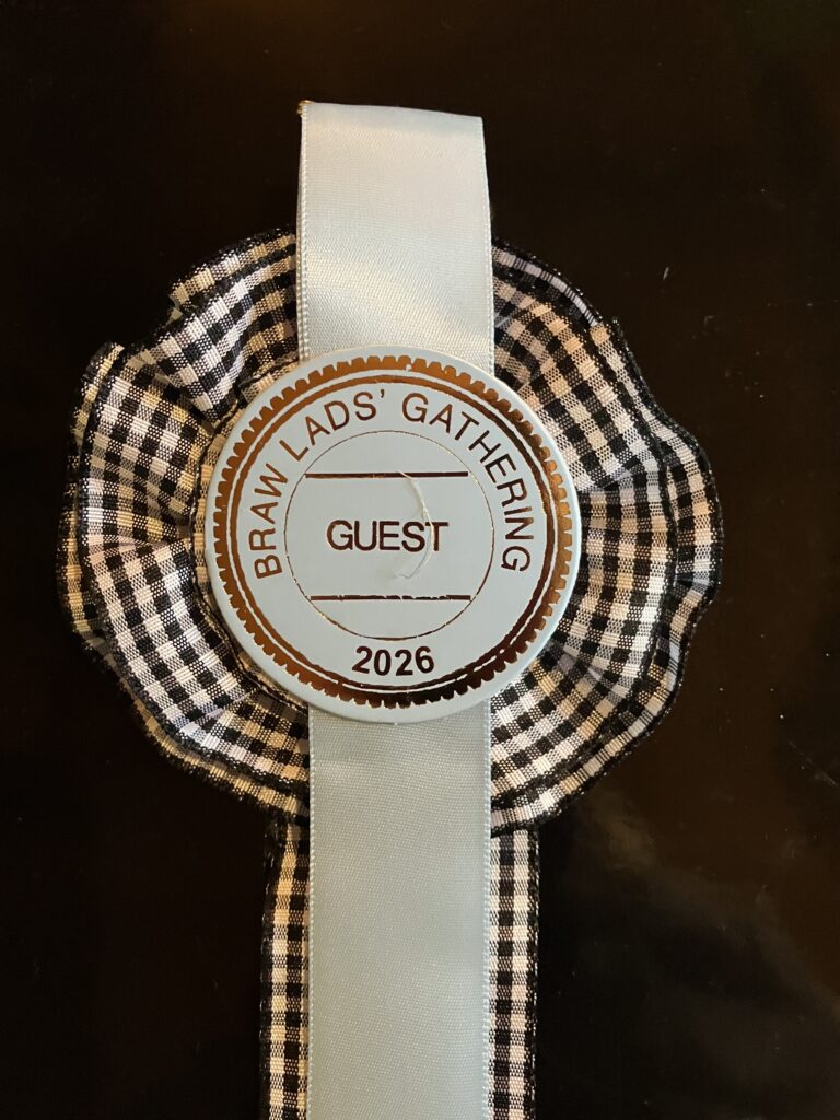 The black and white cockade and visitor badge presented to Martha at the 2026 “Braw Lads and Lassies” Gathering, photo by Martha Hartzog