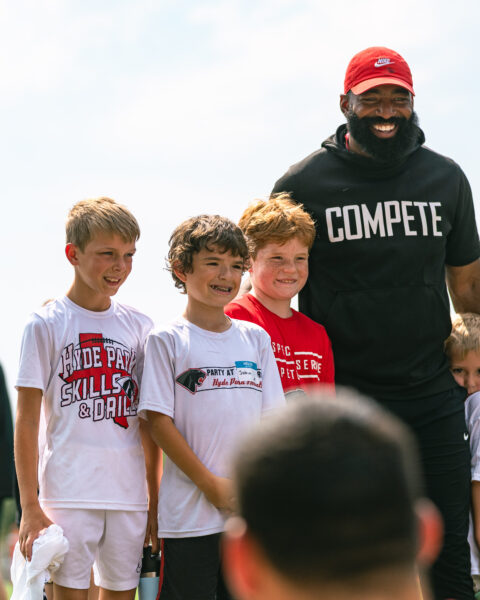 Bennett Nurnberg, Joshua Manning, Everett Weathers with Coach Roby for Skills and Drills Football Clinic