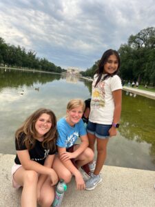 Rising 7th Graders Ella G., Violet N., and Reena D. at the Lincoln Memorial