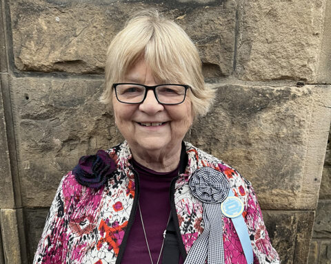 Martha outside the Reception Hall in Galashiels, as a guest at the “Braw Lads and Lassies” Common Riding of 2026, photo by Cyrus Cassells.