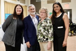 Annie Wells, John and Dixie Paulos, and Any Baby Can Board Chair Zeena Querbach