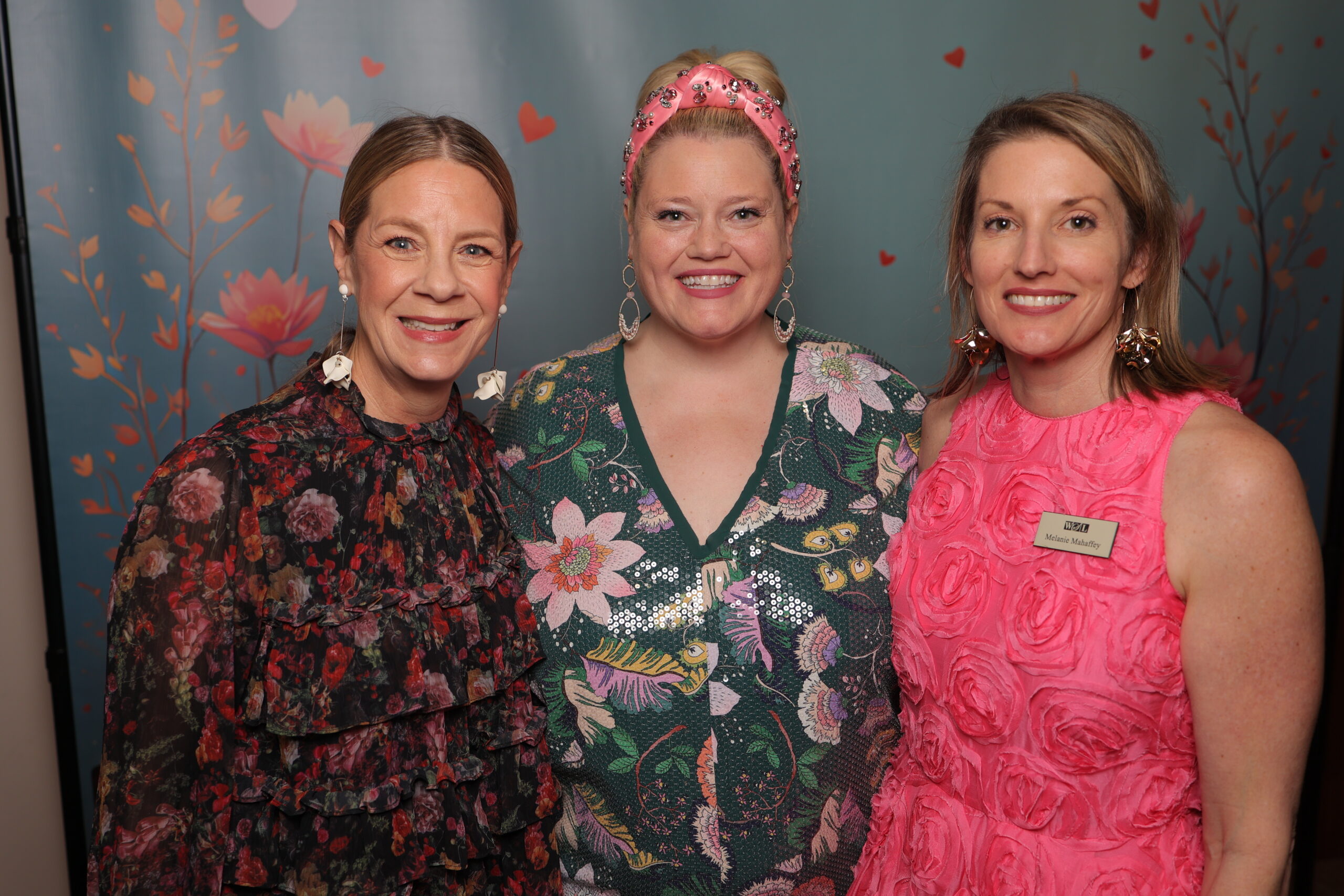 Red Haute Chair Amy Hoge Hajdu, WSL VP of Finance & Development Julia Null, and WSL President Melanie Mahaffey