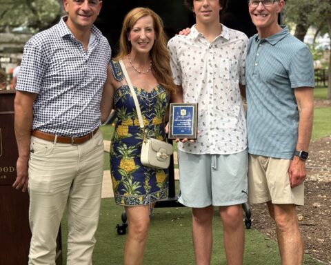 Coach Trey with Price Malone recipient, Judah Schwartz and his parents, Kelly and Offir Schwartz.