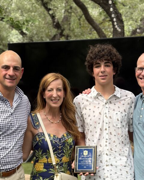 Coach Trey with Price Malone recipient, Judah Schwartz and his parents, Kelly and Offir Schwartz.