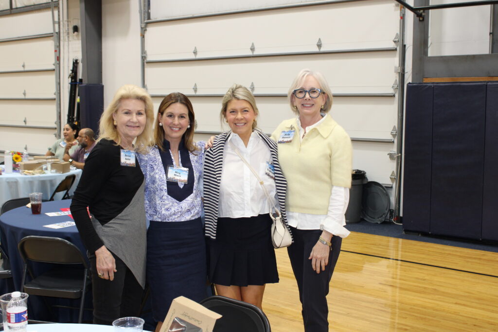 Susan Auler, Meg Moss, Board President Shaun Dickerson, and Molly Sherman