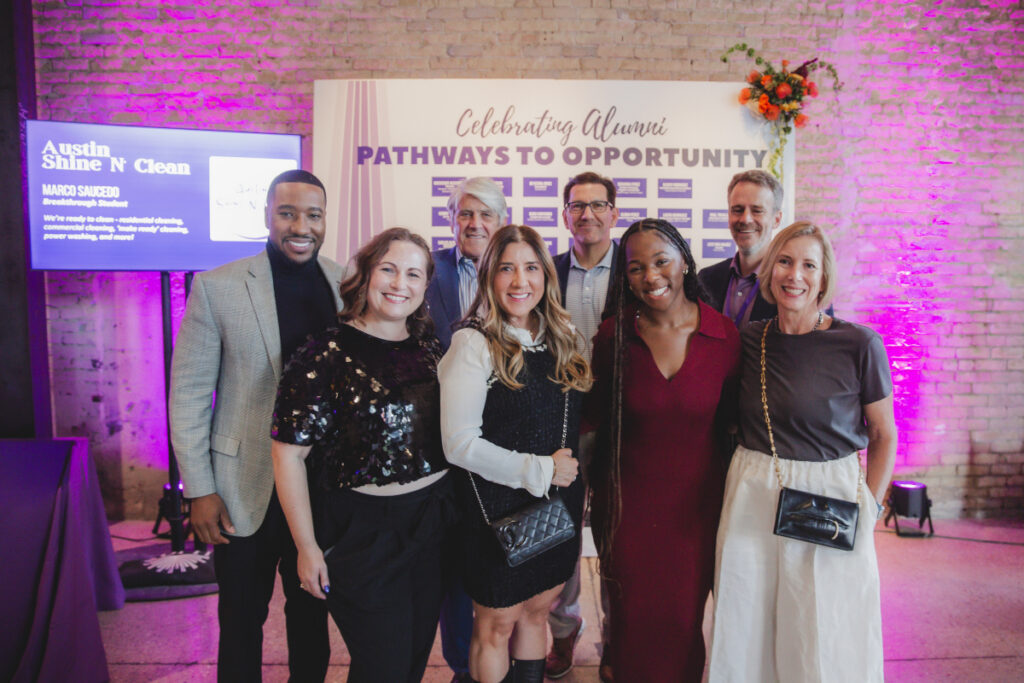 Back Row, L-R: Emcee David Walker, Co-Chairs Jim Brand and Steve Martinez, Executive Director Michael Griffith. Front Row L-R: Chief Development Officer Holly Wissman, Co-Chair Irma Brand, Alumna De-Keona Jones, and Co-Chair Wendy Martinez