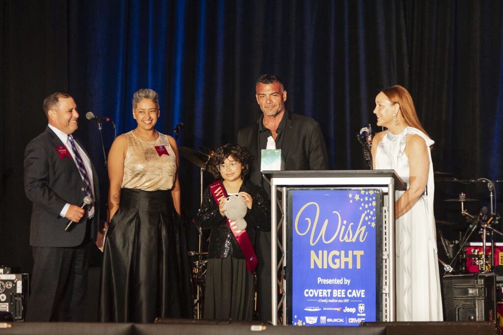 Wish Dad Piero, Wish Mom Elizabeth, and Wish Kid Maya, General Manager Covert Auto Group Mike Ishak, and CEO Andrea Taurins