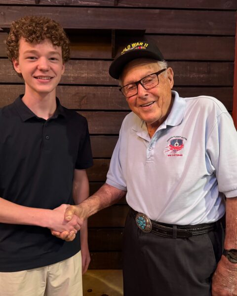 SMPS Junior Chris McGlathery with 102-year-old Westlake resident and World War II veteran pilot Lew Griffith