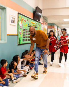 Derrick Johnson enjoying time with students at Barbara Jordan Elementary School (Photo Credit: Giant Noise, Garrett Smith)