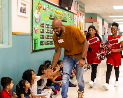 Derrick Johnson enjoying time with students at Barbara Jordan Elementary School (Photo Credit: Giant Noise, Garrett Smith)