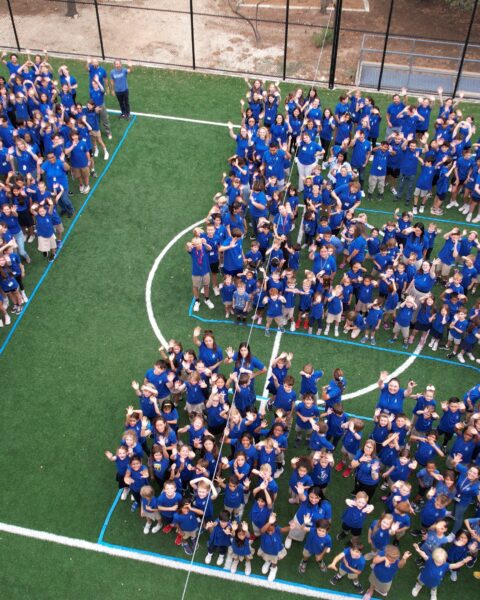 Aerial view of Kindergarten through 9th-grade students forming a 15