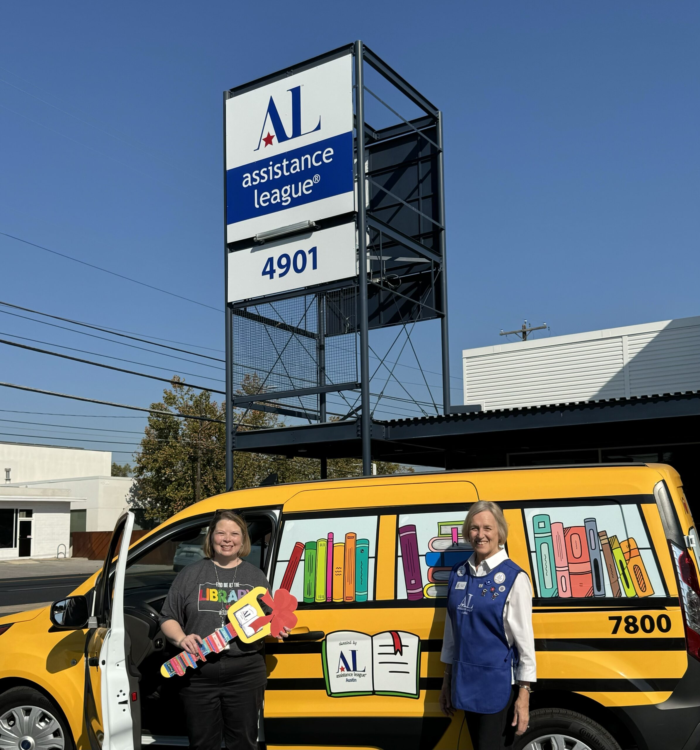 AISD Library Coordinator Shannon Pearce and ALA President Linda Noy in front of ALVAN, the newly donated book van