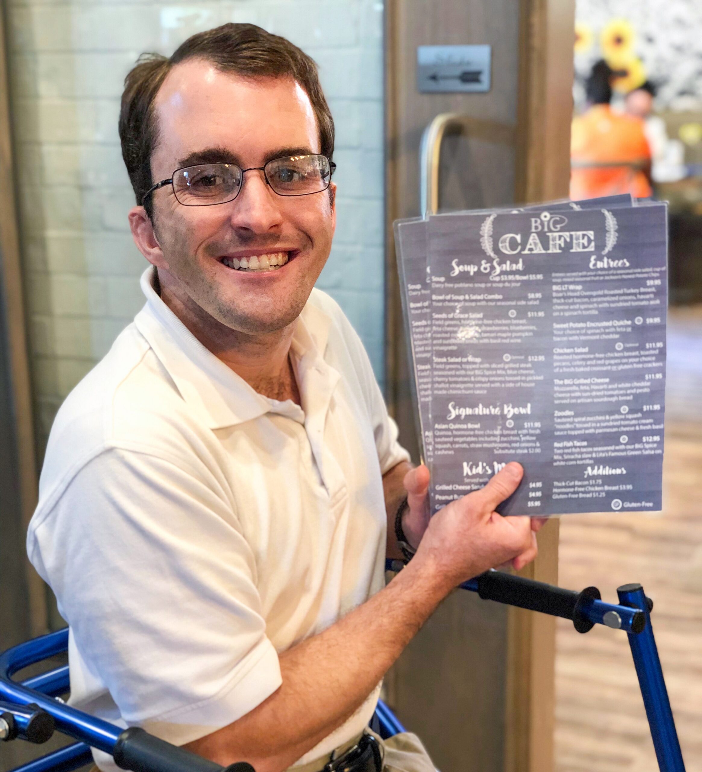 BiG Citizen Bradley ready to greet guests at the BiG Cafe during his shift