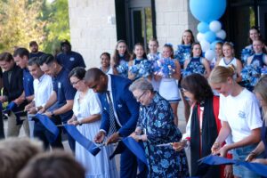 Ben Hamilton (LPA Architects), Dawson Merrill (Harvey Cleary Builders), Sean Greenberg (Board Chair), Thomas Sale (Athletic Director), Alice Nezzer (Assoc Head of School), Dr. Steven Fletcher (Head of Upper School), Melissa Grubb (Head of School), The Rt. Rev. Kathryn M. Ryan, Bishop Suffragan, Ava Barnard ‘26 (Student Senate President)