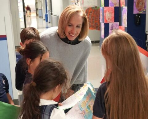 St. Michael’s Prep Head of School, Colleen Lynch, engaging with students between classes