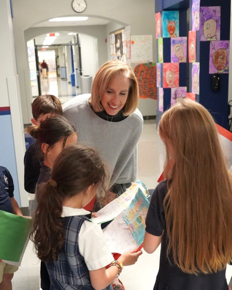 St. Michael’s Prep Head of School, Colleen Lynch, engaging with students between classes