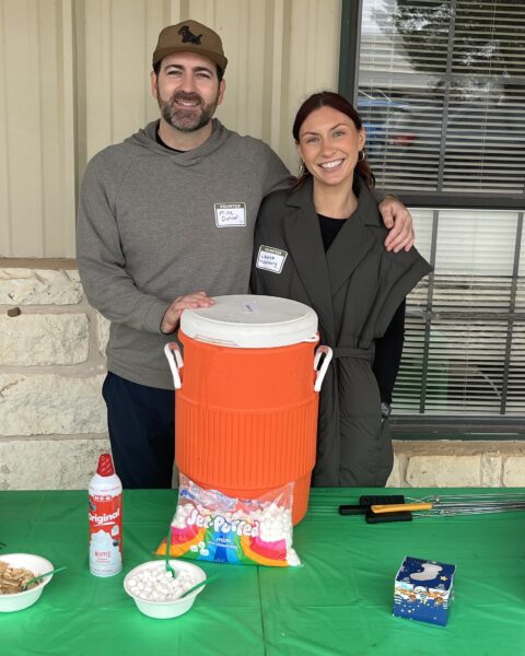 Volunteers Mike Duncan and Lauren Hackenburg tending the s'mores table