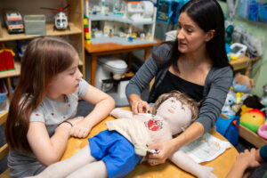 Child Life Specialist Adrianna Ortega, supporting a WW child