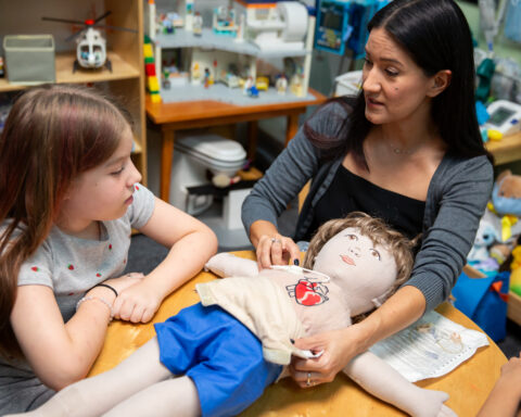 Child Life Specialist Adrianna Ortega, supporting a WW child