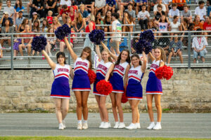 St. Stephen's Upper School cheerleading squad rooting for the Spartan football team