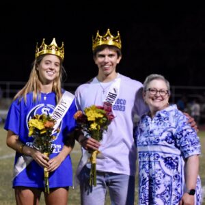 Homecoming Queen and King, Emily Gregg and Charlie Moore with Head of School Melissa Grubb