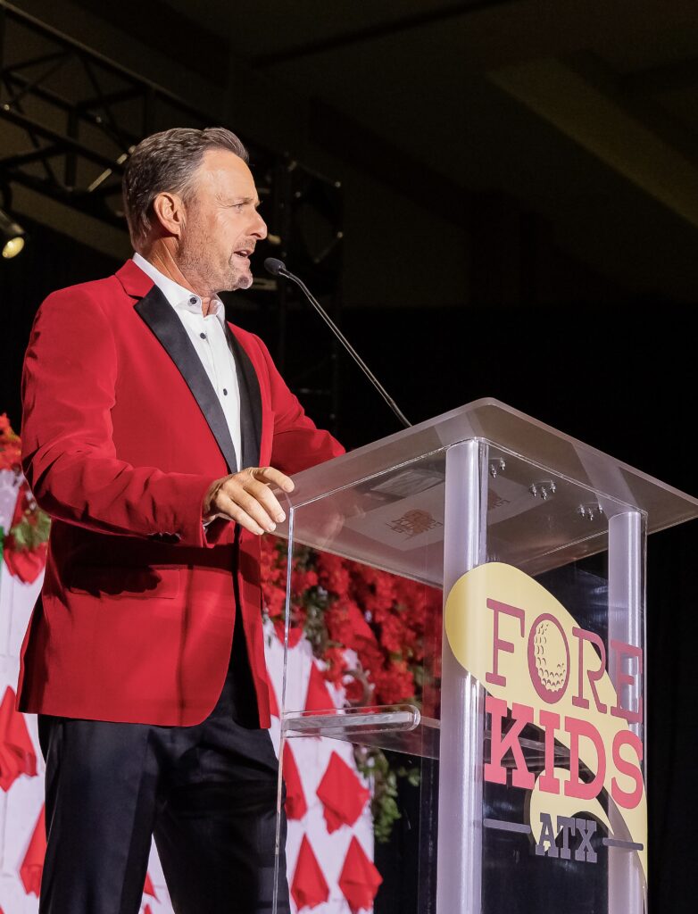 Co-host and television personality Chris Harrison emcees the evening program at the 2025 FORE Kids ATX PAR-Tee