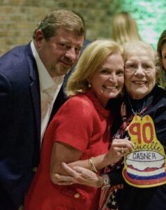 Drew and wife Misty Tate with Casner Christian Academy founder Lucille Casner at the annual Red, White & Blue fundraising event