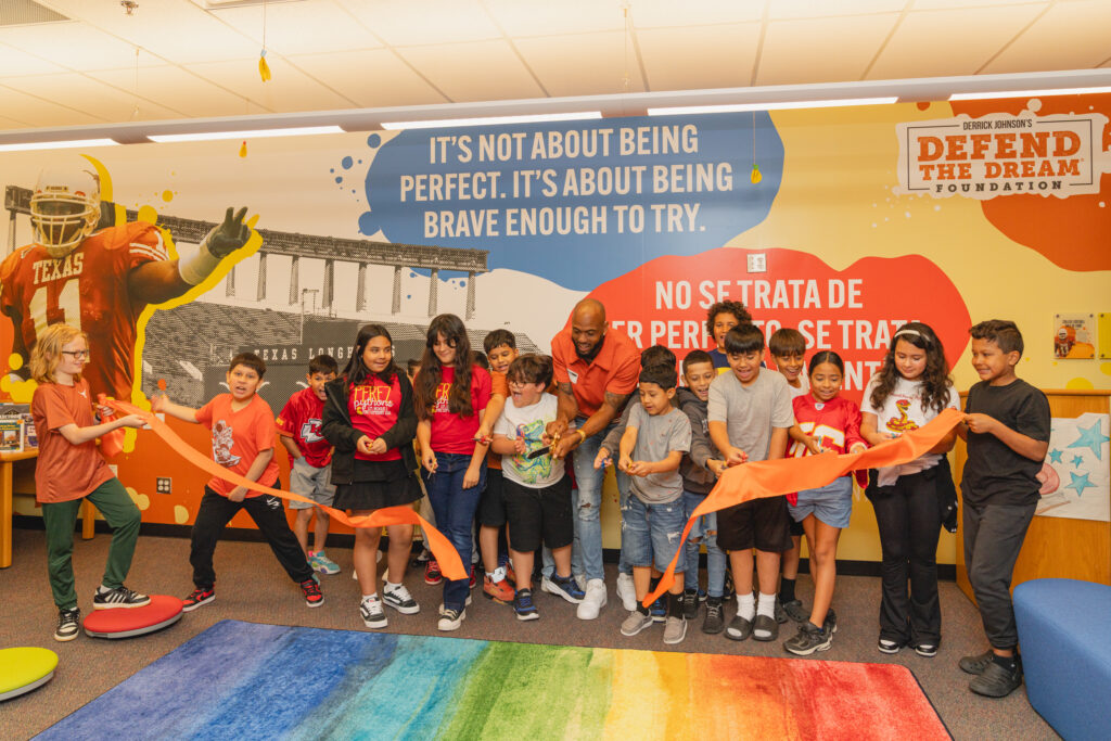 Students at Perez Elementary and Derrick Johnson at their Discovery Den Ribbon Cutting (Photo Credit: Jane Yun)
