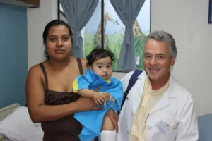 Dr. Fred Wilder, 2026 Award Winner with Patient and Parent after Surgery