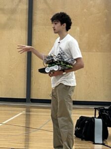 Falcon Fighters RVR Programmer/Driver William Radtke holding a rover